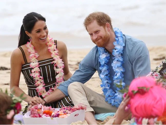 Prince Harry and Meghan barefoot in the sand