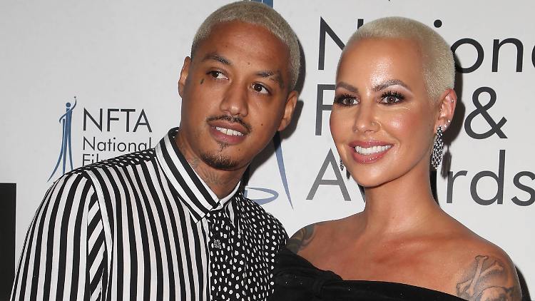 Amber Rose shows baby belly with happy face